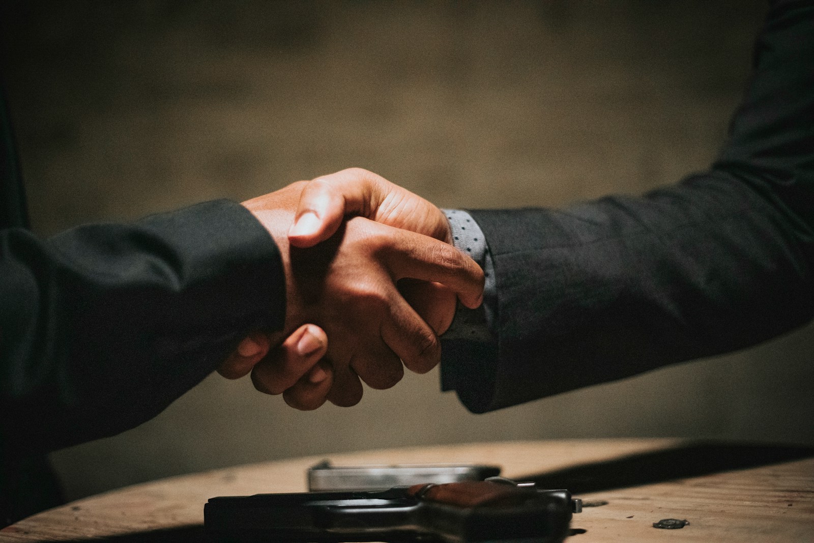 Buyer and real estate agent shaking hands after winning a bidding war on a Grand Rapids MI home